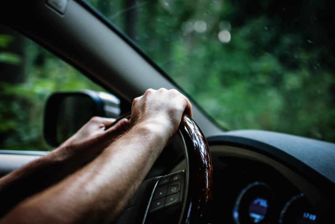 Vehicle owner driving their new car.