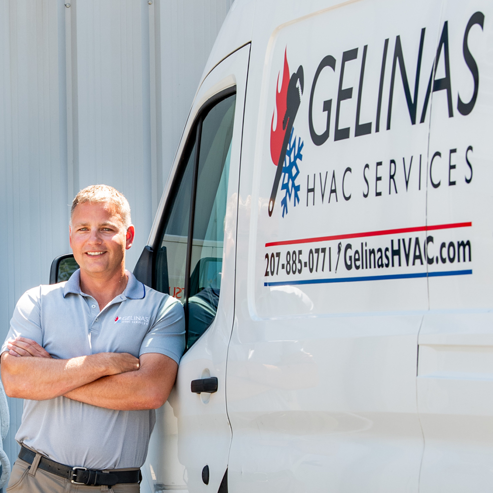 Photo of Justin Zandan Standing next to a truck labelled 