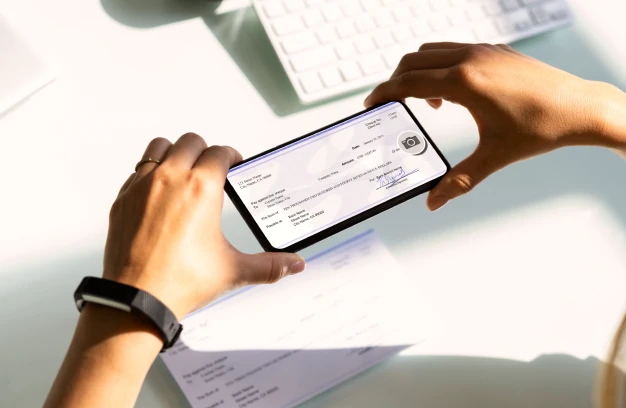 person depositing a check via mobile device